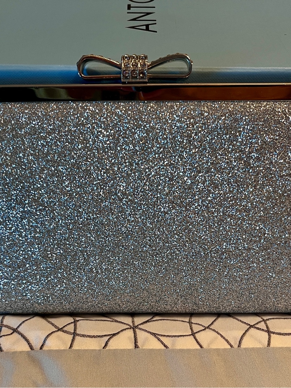 INC International Concepts Silver Glitter Clutch with Bow Accent
